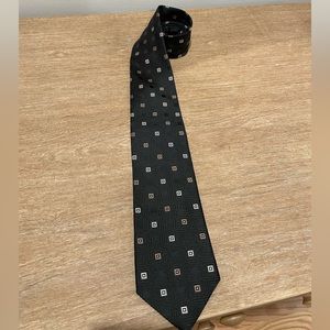 Black Michael Kors tie. Squares are white and light brown/gold.